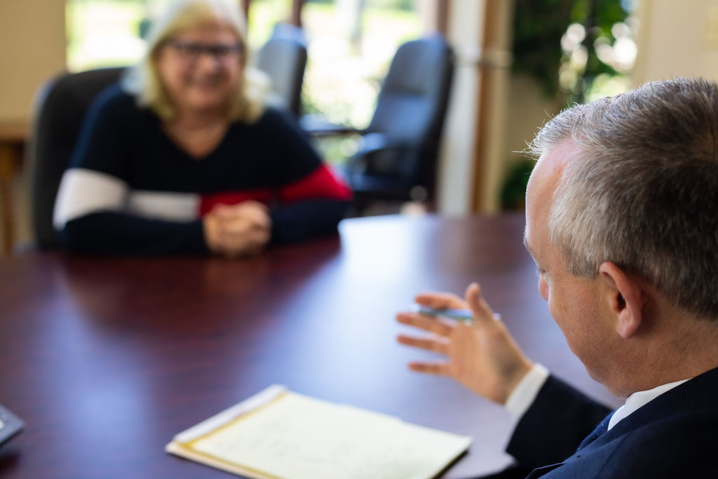 Christopher A. Sharry at table with client